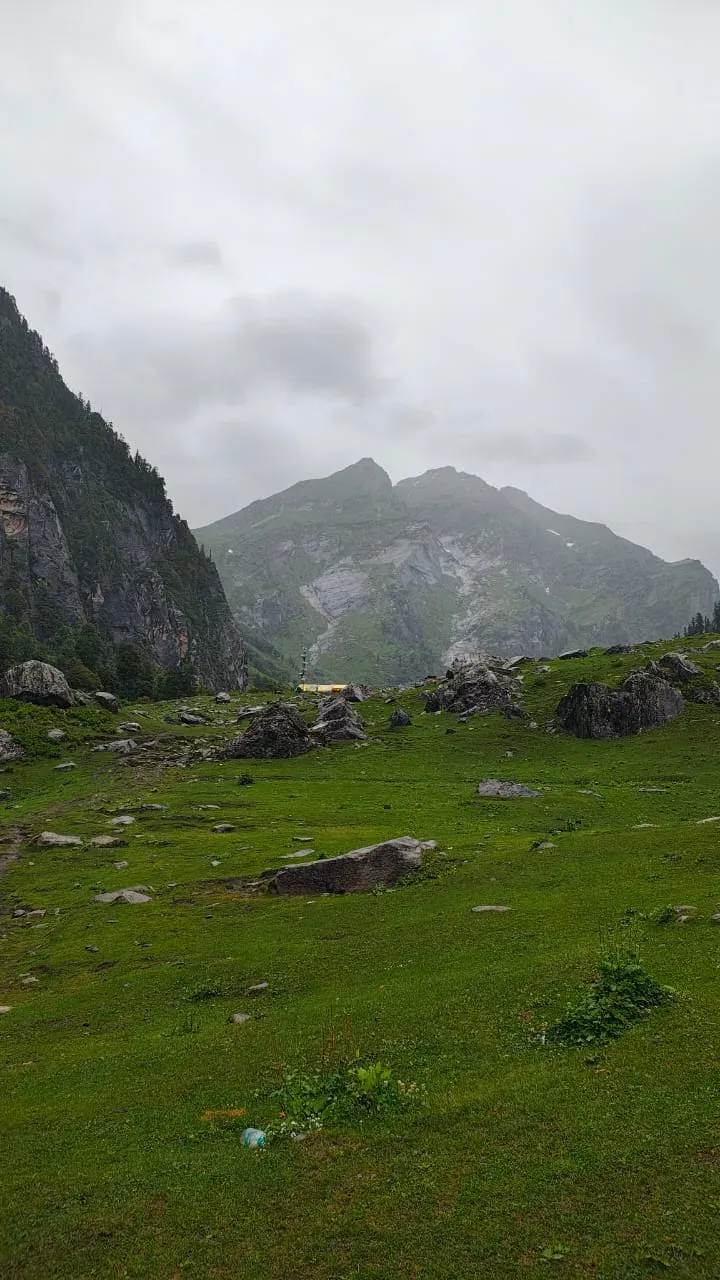 Clouds sliding over sheer cliffs with waterfalls stitching the valley together | © MountRoutes