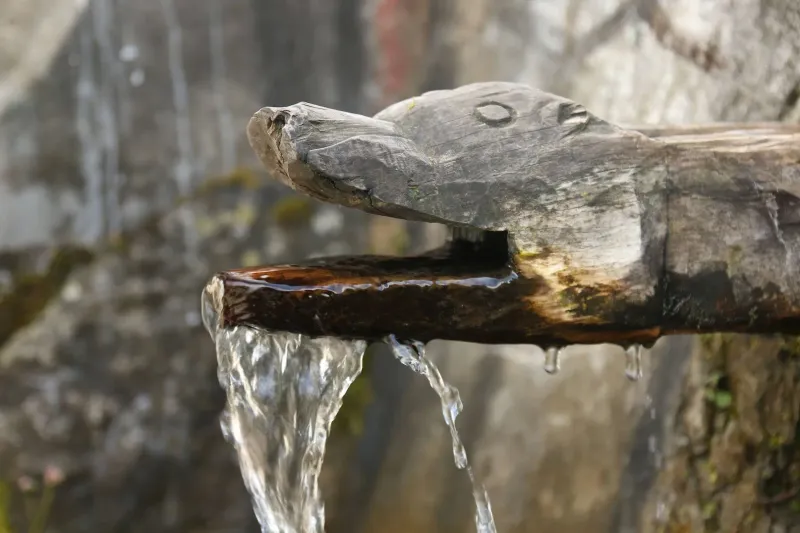 Traditional wooden water points used by locals along the Bali Pass trekking route. | © MountRoutes