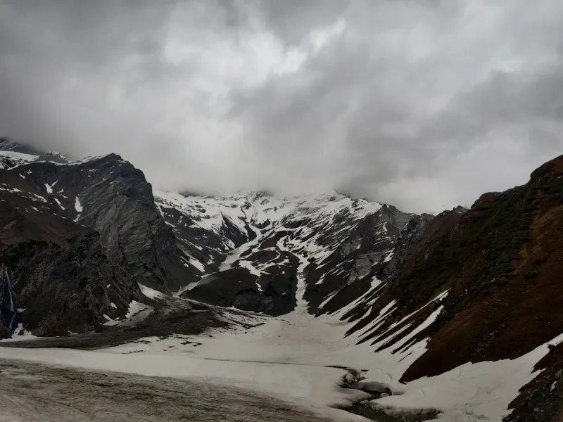 Setting up our high camp on the frozen moraines of Beas Kund in late April. | © MountRoutes