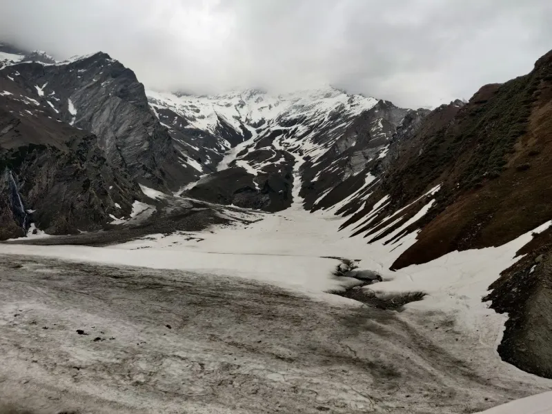 The hidden gem — the sacred Beas Kund lake tucked away behind the massive glacial ridges. | © MountRoutes